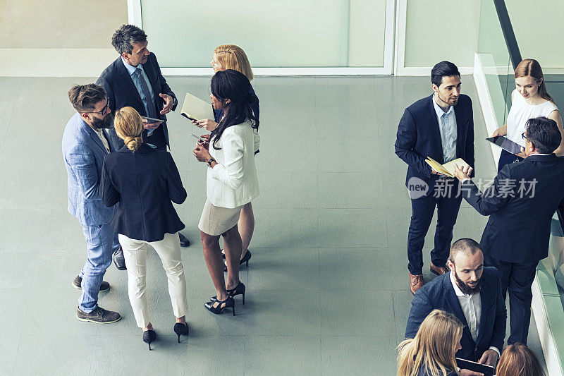 Group of business people in the office building lobby